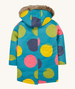 The back of the Frugi penhale super spot  parka. A thick long length light blue hooded coat with big circles printed all over 