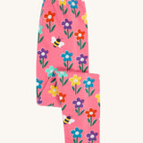 Frugi organic cotton kids Libby leggings with a fun flowers print on a pink background.
