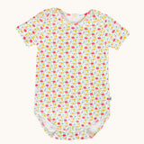 The all over floral ditsy print baby vest from the Frugi Pointelle short sleeved baby vest 2 Pack, one with a Ditsy Floral all over print the other had a pink and white stripe design.