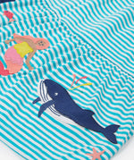 A close up of Frugi Pixy Sea Moss Mini Stripe Dress, with a Sealife print along the bottom, featuring a whale and a Mermaid.