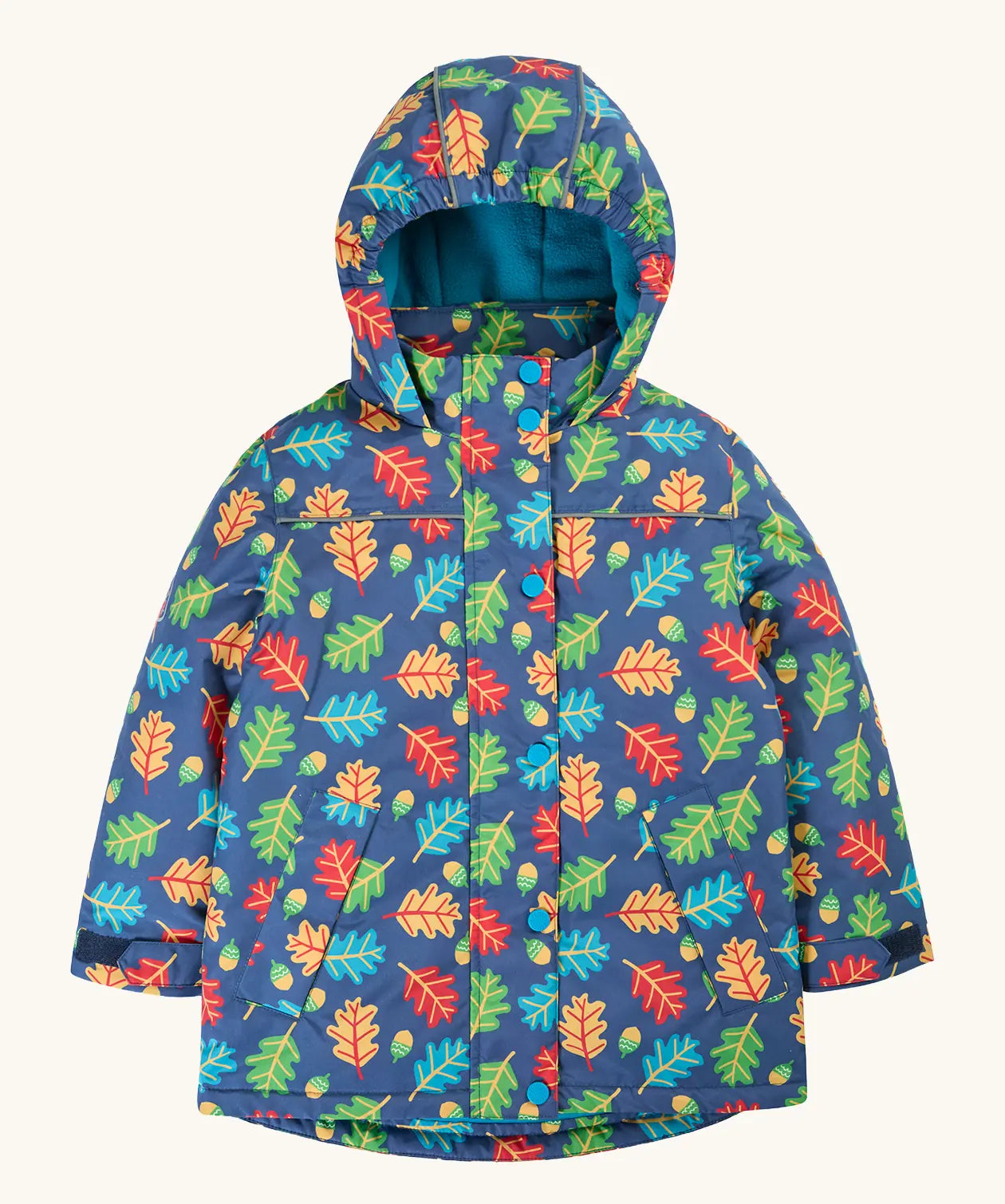 Frugi children's playtime waterproof coat with a multi-coloured acorn tumble print on a navy background.