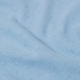 Close up of the organic cotton material of the Frugi pointelle long sleeved baby body in winter sky blue. 