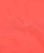Frugi long sleeve top in rhubarb pink organic cotton showing close up of the pointelle texture