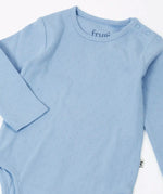 Frugi pointelle long sleeved baby body in winter sky blue with popper closure on the shoulders. 