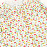 A close up of the front of the Frugi Pointelle Organic Cotton footed Babygrow with an all over Ditsy Floral print.