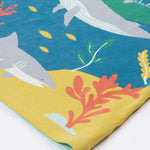 A close up of Frugi Iori Printed T-Shirt in Spring Mint's colourful Sea Life Scene which includes whales, sharks and other smaller fish and coral. 