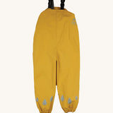 The Frugi children's waterproof Puddle buster trousers with elasticated arm straps, in bright Bumble Bee Yellow.