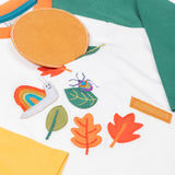 Frugi organic cotton Alfie interactive long sleeved top. The interactive element is a liftable circle that forms the head of the magnifying glass.
