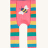 The back of the Frugi rainbow bee design organic cotton leggings footless tights. The legs are rainbow striped with a bee detail on the behind.