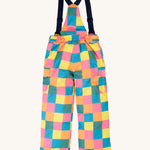 The back of the Frugi kids snow and ski salopettes in rainbow check. showing the elasticated waist band detail on brigh tchecked recycled polyester fabric