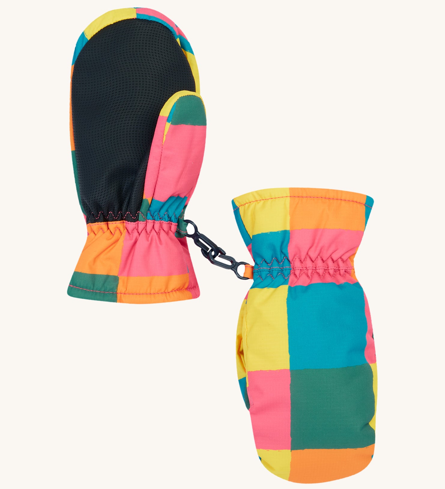 The back of the Frugi kids rainbow check snow mittens. Showing the grippy palm detail on recycled polyester fabric.