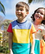 A child wearing the Frugi Rainbow Colourblock Treen Panel T-shirt.