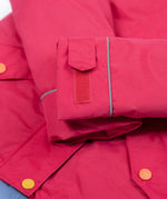 A close up of the Frugi kids 3 in 1 rambler coat in snapdragon /navy colourway showing the velcro detail on the arm for size adjusting. 