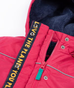 A close up of the Frugi kids 3 in 1 rambler coat in snapdragon /navy colourway showing the zip detail and navy fleece liner inner on the hood