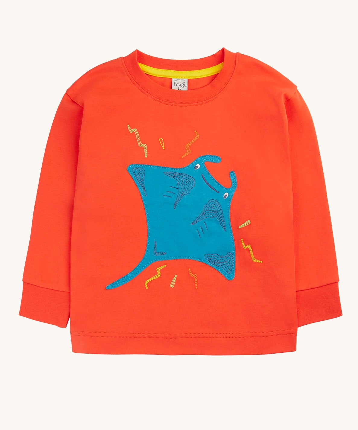 Frugi orange children's jumper with a large blue coloured ray applique on the front. 