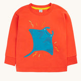 Frugi orange children's jumper with a large blue coloured ray applique on the front. 