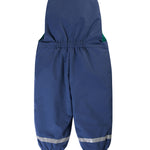 A child outside wearing the Frugi Children's Little Waterproof Dungarees - Navy Blue