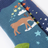 A close up of the reindeer on the Frugi Festive Reindeer Great Organic Cotton Grippy Socks for Kids 2 Pack. These socks have green coloured grippy stars on the soles. These socks are part of a wide range of organic cotton clothing for children available here at Babipur. 