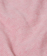 A close up of the Frugi kids remi knitted romper in pink marl /flowers showing the soft knit detail