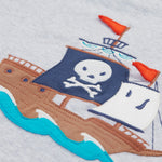 A close up of Frugi Renny Raglan T-Shirt in Grey Marl, featuring an embroidered pirate ship design in the centre.