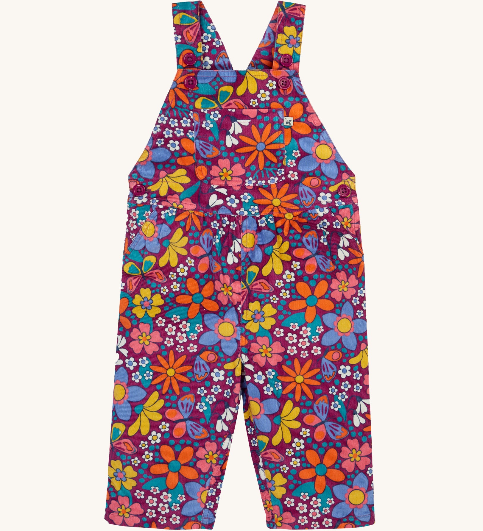 Frugi Elspeth Retro Floral Organic Cotton Corduroy Toddler Dungarees. A purple coloured corduroy with retro flower detailing all over.  These cord dungarees are a part of a wide range of organic cotton clothing for children available here at Babipur. 
