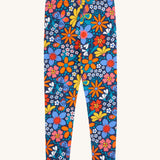 Frugi Retro Floral Leona Organic Cotton Kids' Leggings. A navy coloured legging with a bright multicoloured retro style flower print all over. These leggings are part of a wide range of organic cotton clothing for children available here at Babipur. 