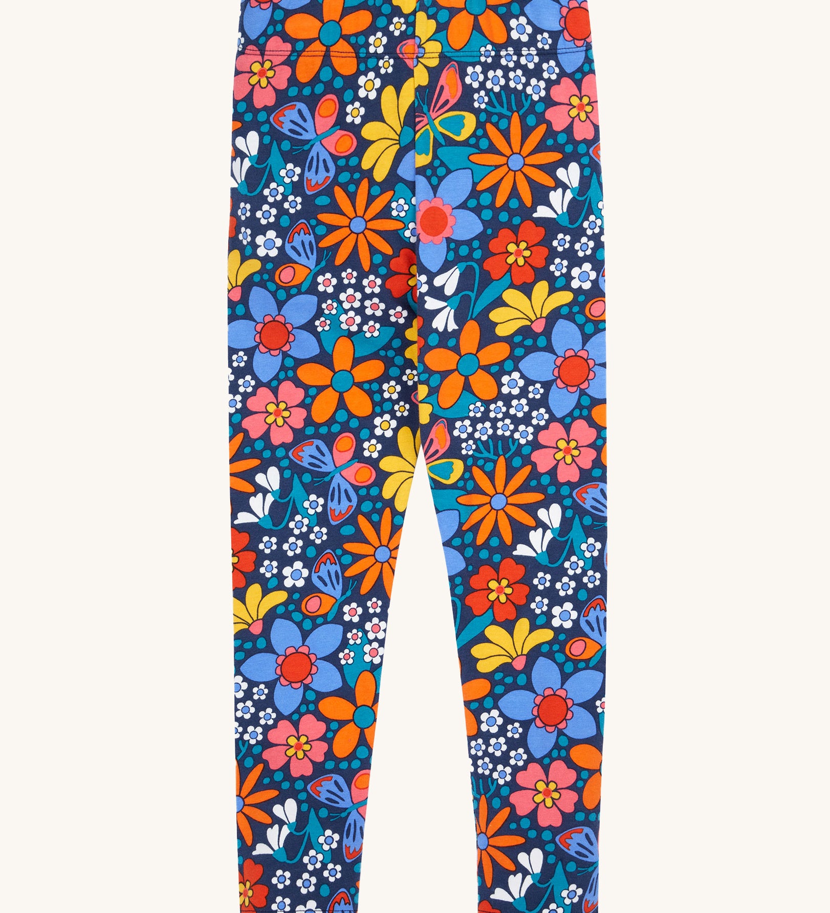 Frugi Retro Floral Leona Organic Cotton Kids' Leggings. A navy coloured legging with a bright multicoloured retro style flower print all over. These leggings are part of a wide range of organic cotton clothing for children available here at Babipur. 