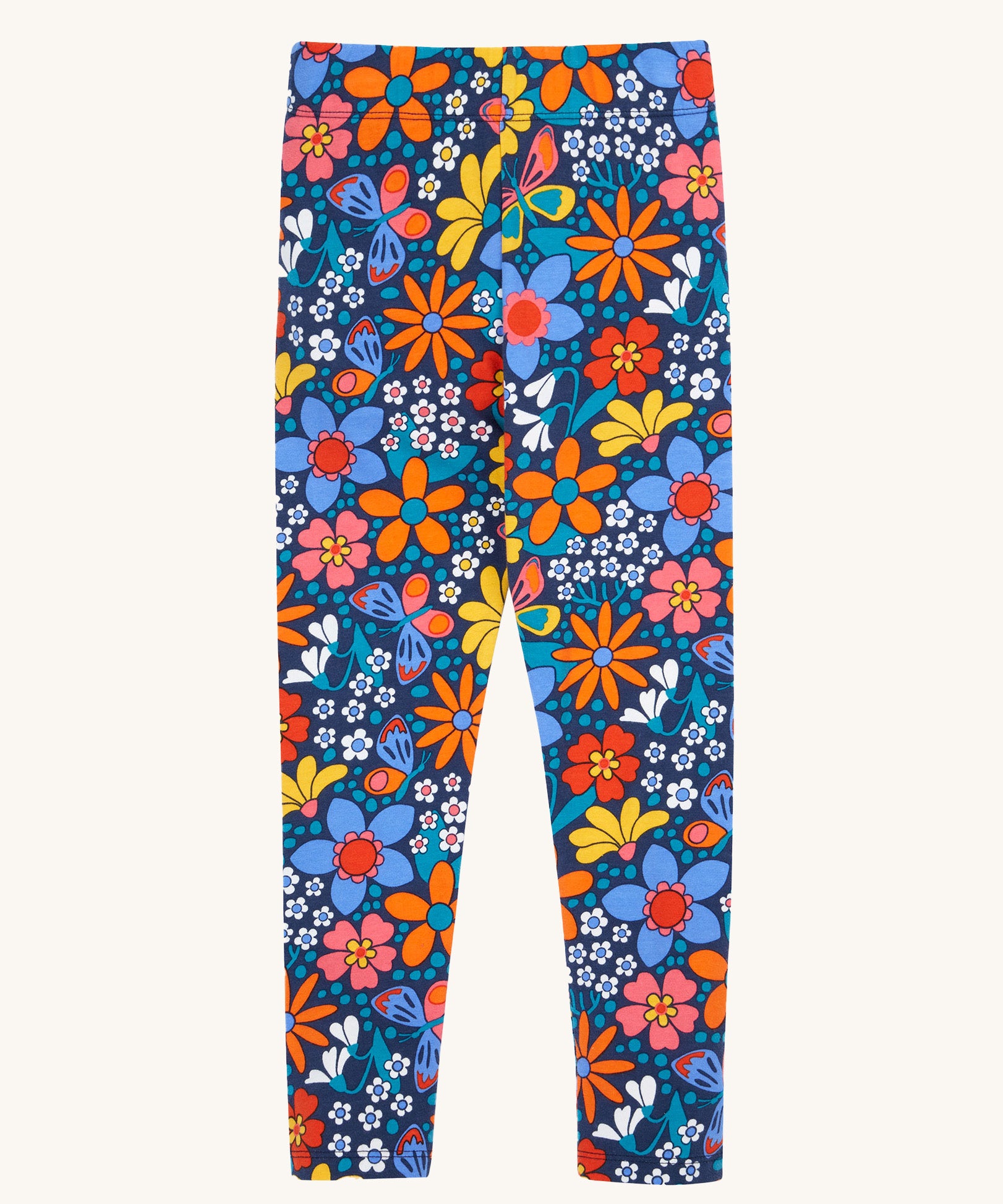 Frugi Retro Floral Leona Organic Cotton Kids' Leggings. A navy coloured legging with a bright multicoloured retro style flower print all over. These leggings are part of a wide range of organic cotton clothing for children available here at Babipur. 