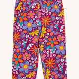 Frugi Retro Floral print Nieva Cotton Corduroy Trousers. A purple coloured corduroy with a colourful all over floral print. These trousers are part of a wide range of organic cotton clothing for children available here at Babipur.