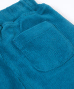 A close up of the back pocket detail on the The back of the Frugi Poppy Reversible Pull Ups - Blue / Wild Woods available at Babipur