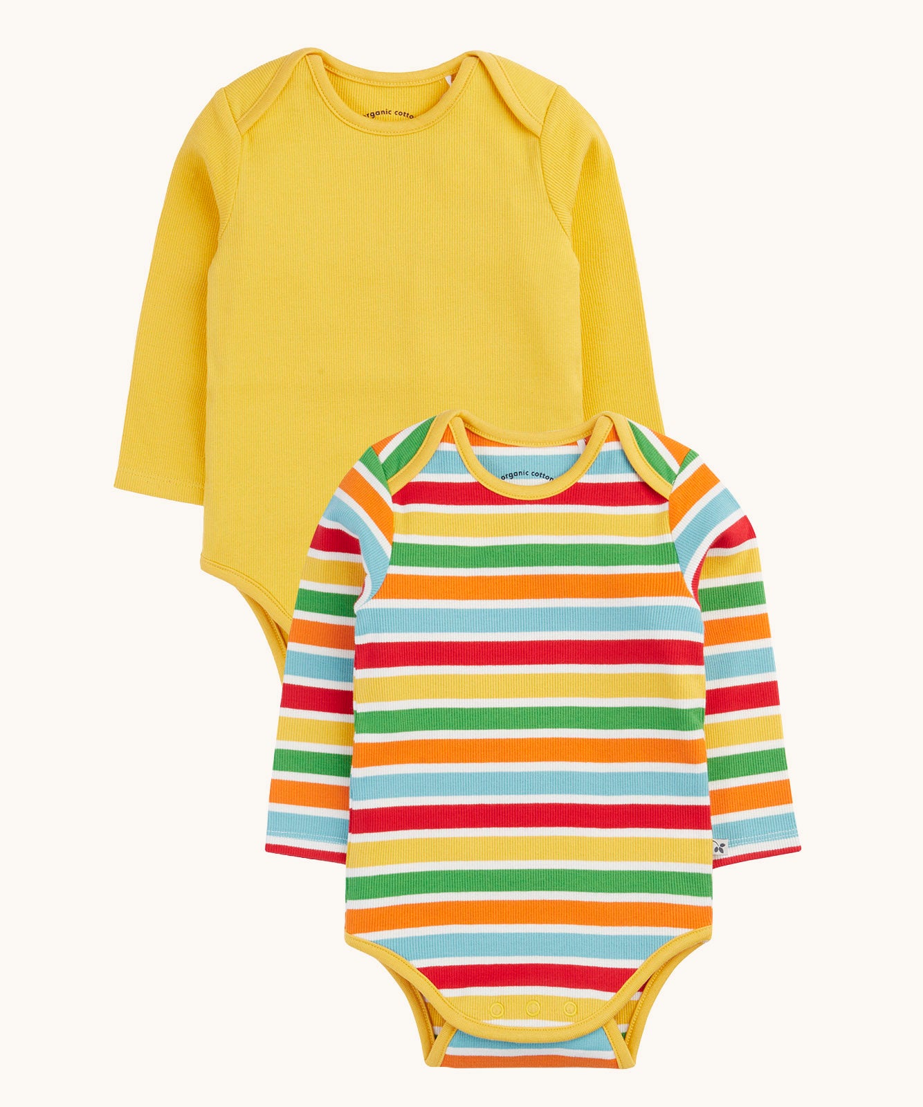 Frugi ribbed material 2 pack long sleeved body vests One vest is plain yellow the other has rainbow stripes, bands of red, pastel yellow, green, orange and pastel blue in between thinner white stripes. 