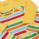 A close up of the envelope necks on the front of the Frugi ribbed material 2 pack long sleeved body vests One vest is plain yellow the other has rainbow stripes, bands of red, pastel yellow, green, orange and pastel blue in between thinner white stripes. 