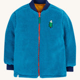 Frugi robin reversible quilted jacket in yellow gold with boat blue fleece. The jacket is shown with the blue coloured fleece on the outside.