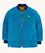 Frugi robin reversible quilted jacket in yellow gold with boat blue fleece. The jacket is shown with the blue coloured fleece on the outside.