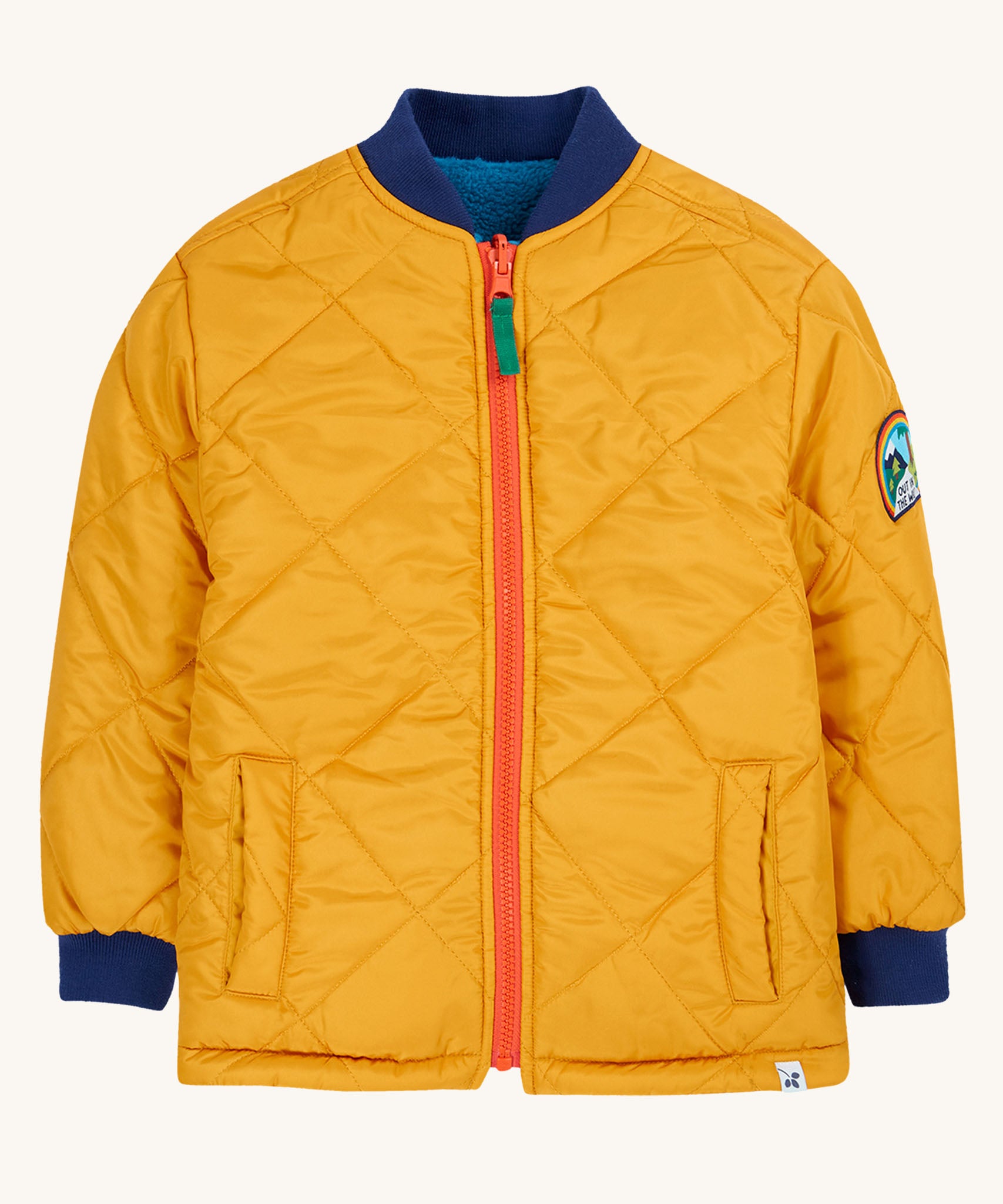 The Frugi robin reversible quilted jacket has a yellow gold colour on one side with a boat blue coloured fleece on the other.