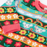 Close up of the Frugi Robyn fairisle cardigan with a mouse Fair Isle design featuring flowers, rainbows, clouds and suns. 