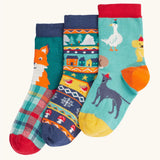 Frugi rock my socks 3 pack paw-ty time pet party organic cotton kids socks. One blue pair covered in pets with party hats, one fair isle design, one festive check with red fox.