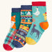Frugi rock my socks 3 pack paw-ty time pet party organic cotton kids socks. One blue pair covered in pets with party hats, one fair isle design, one festive check with red fox.