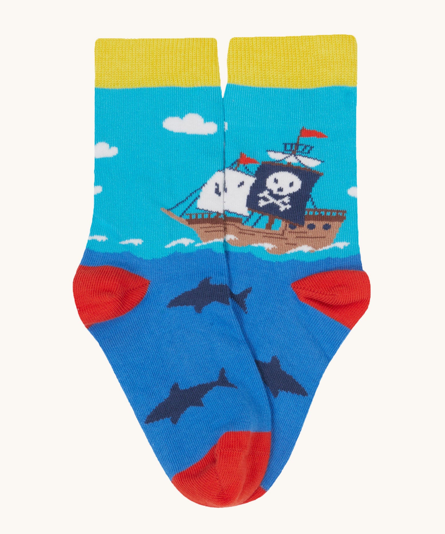 Frugi Rock My Socks laid flat, in the High Seas print. Featuring the blue pirate ship pair.