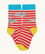 Frugi Rock My Socks laid flat, in the High Seas print. Featuring the bright striped pair with sharks.