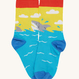 Frugi Rock My Socks laid flat, in the High Seas print. Featuring the brilliant shark pair.