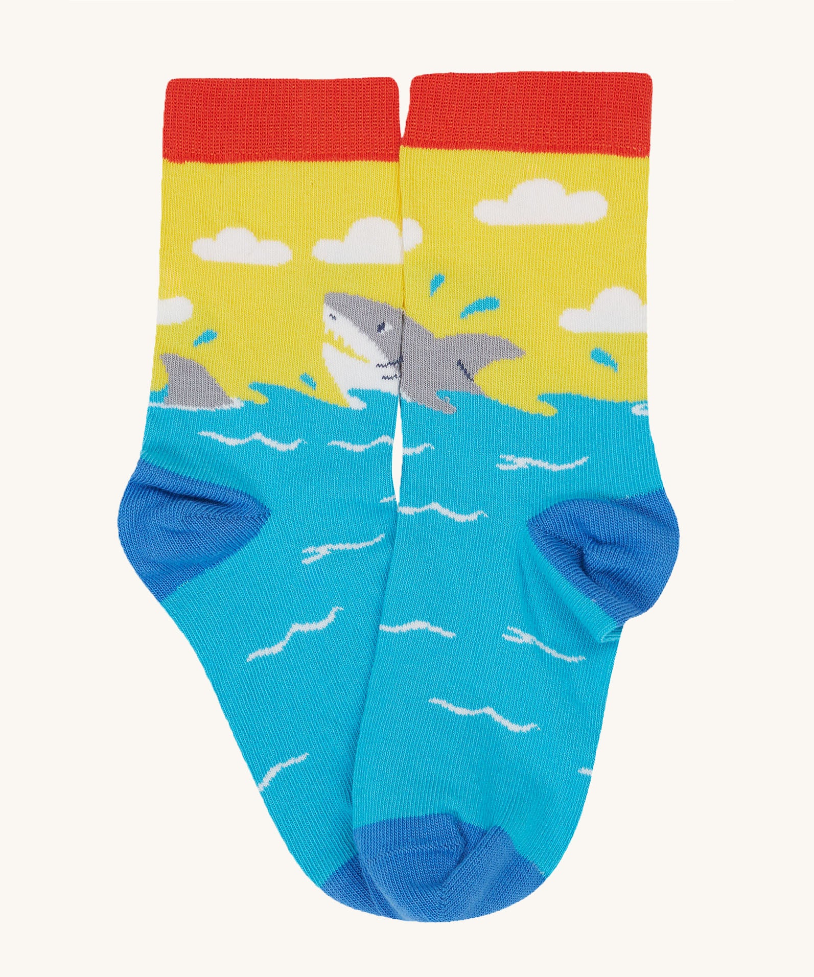 Frugi Rock My Socks laid flat, in the High Seas print. Featuring the brilliant shark pair.