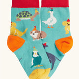 Paw-ty time, pet party design socks from the Frugi rock my socks 3 pack paw-ty time pet party organic cotton kids socks. Blue kids socks covered in pets wearing party hats.