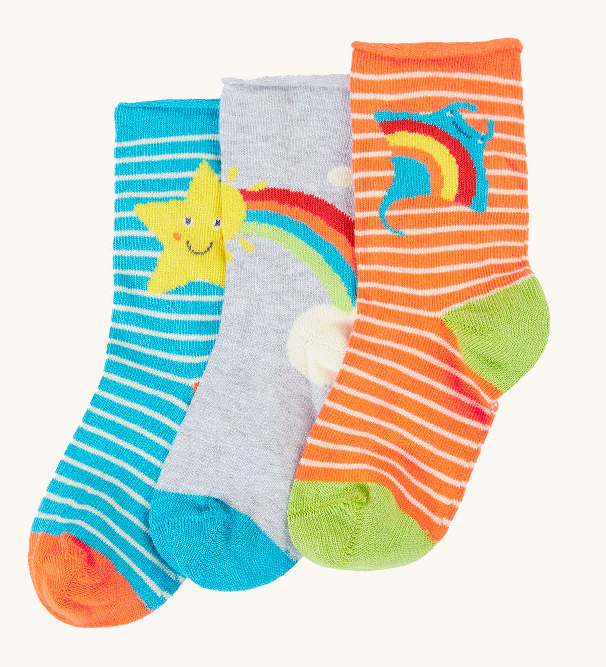 Frugi pack of three bamboo children's socks with roll tops. One blue striped pair with a yellow star, one plain grey with a rainbow and sun and one orange striped pair with a ray. 