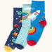 Frugi roly roll top bamboo socks 3 pack with space adventure designs. One navy pair with stars and planets one green striped with earth pair and one blue with a rocket.