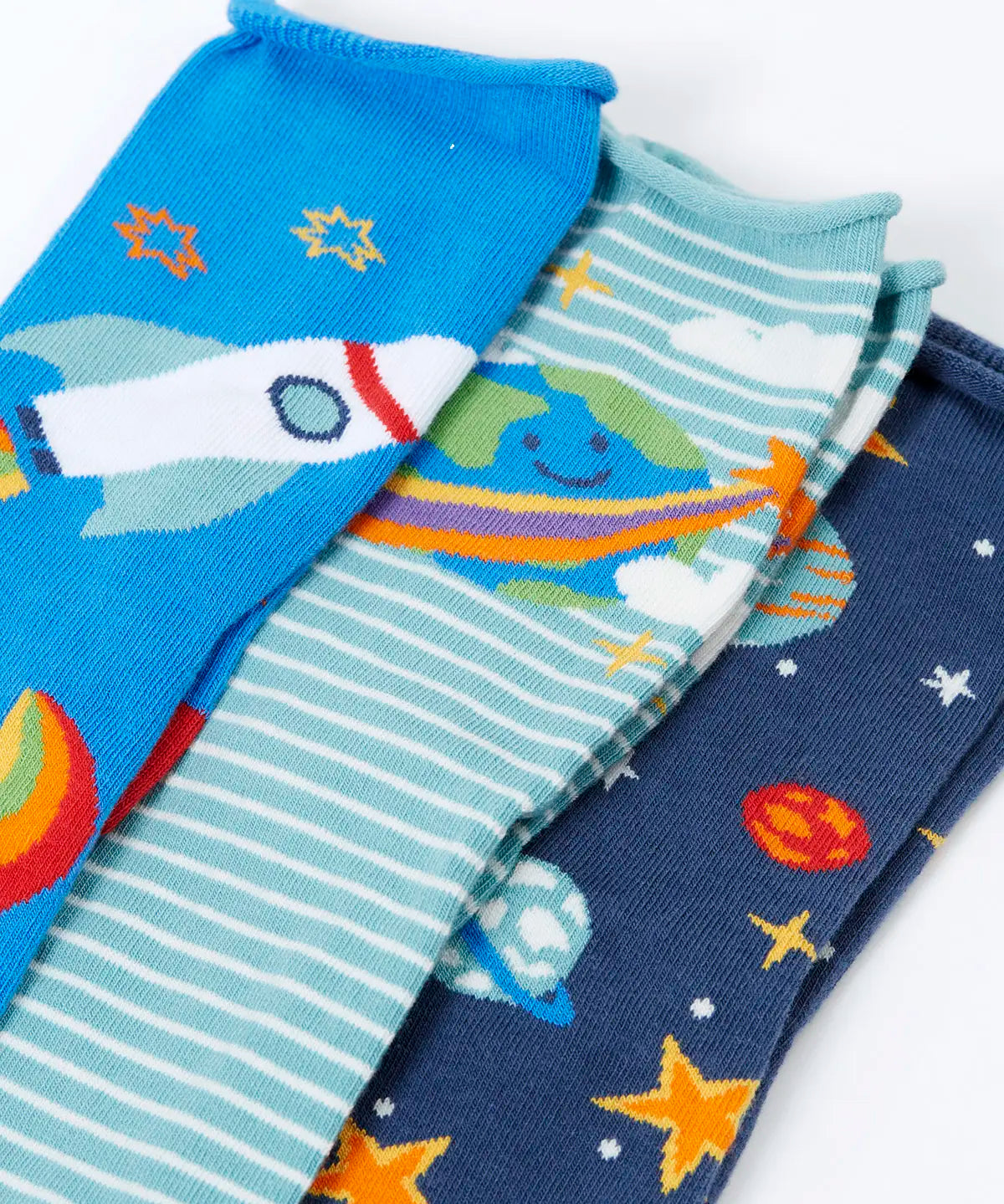 Close up of the Frugi roly roll top bamboo socks 3 pack with space adventure designs. One navy pair with stars and planets one green striped with earth pair and one blue with a rocket.