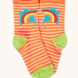 The orange striped roll top socks with a rainbow sting ray and green heel and toe caps.