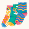 Frugi little roly bamboo socks in a 3 pack with rainbow designs. Rainbow wave stripe pair, green with happy rainbow pair and a patchwork pattern pair.