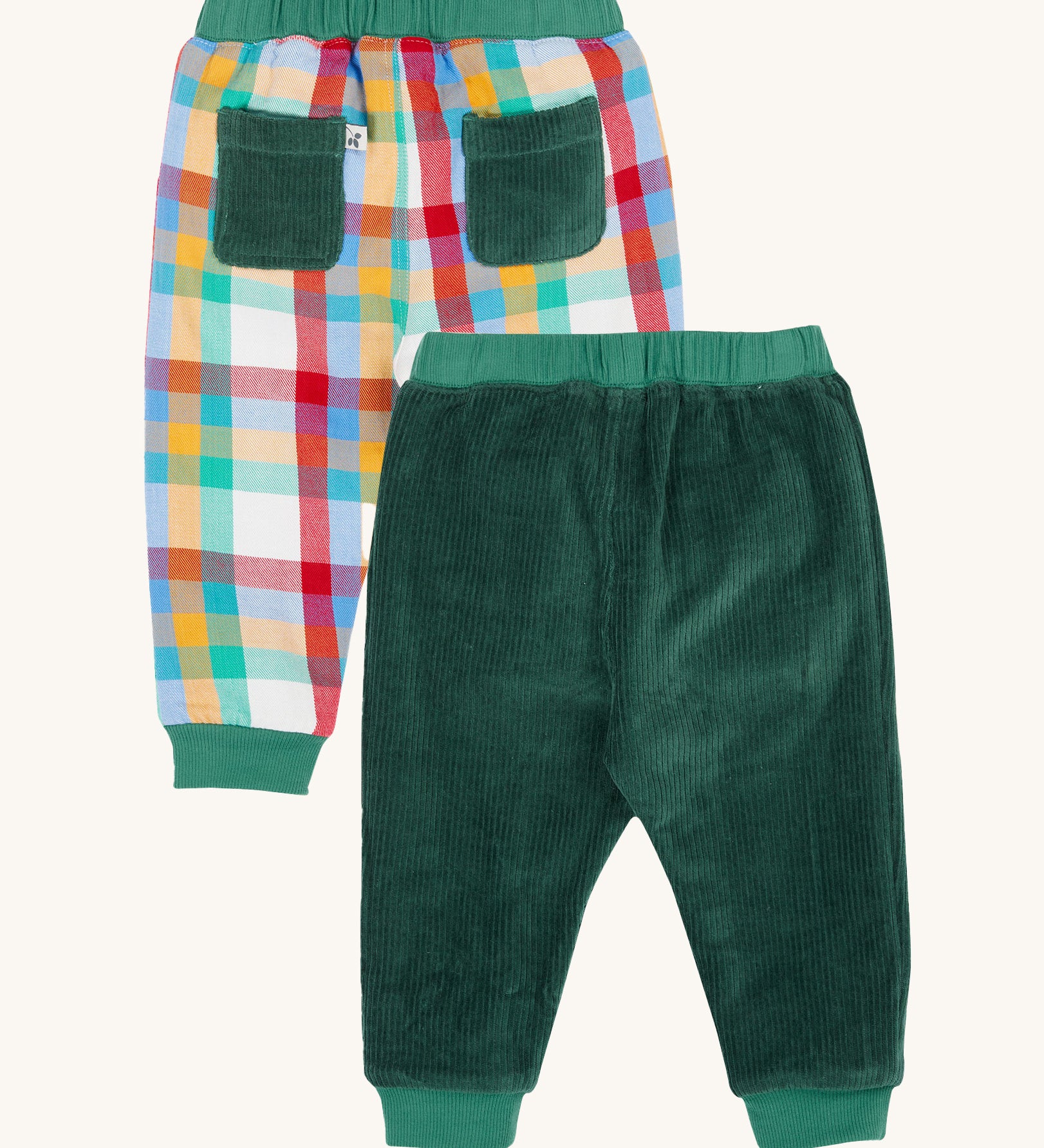 The back of the Frugi Ronnie Holly Green Check Reversible Pull-Up Trousers. One side has a rainbow coloured check and the other side has a holly green corduroy. These trousers are part of a wide range of organic cotton clothing for children available here at Babipur.