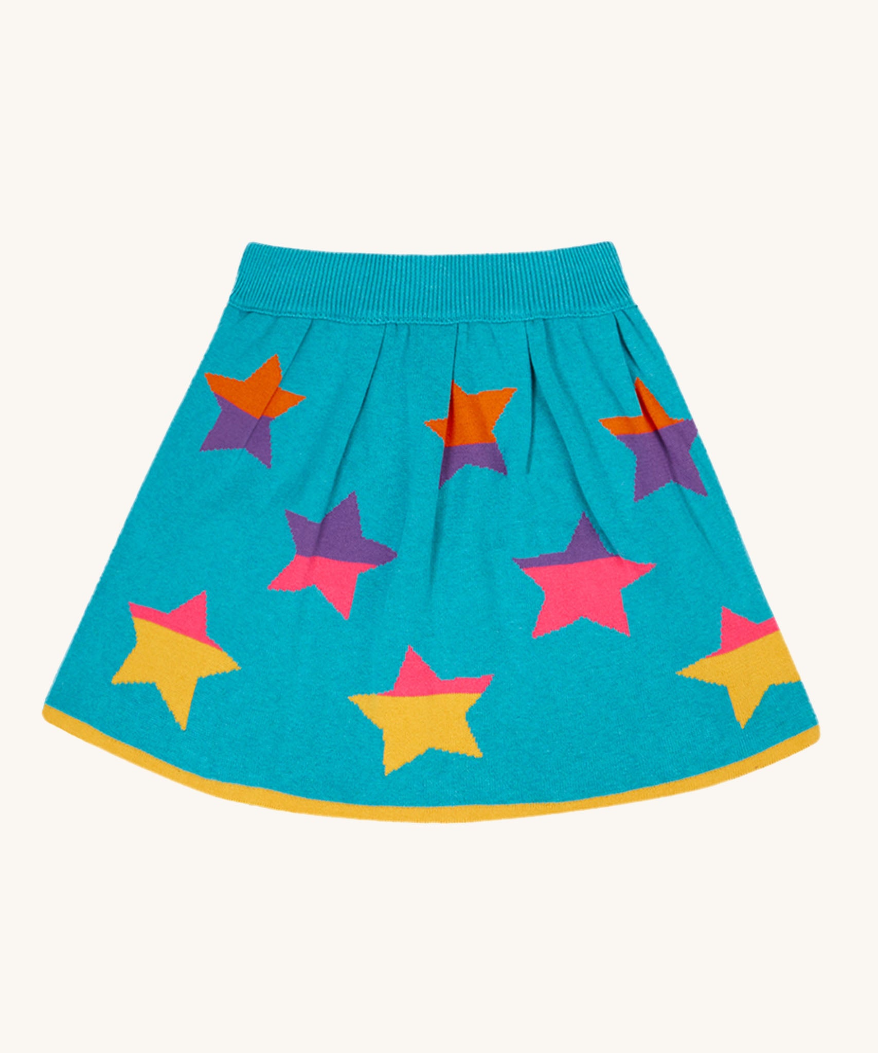 The Frugi Rory Reversible organic cotton kids Skirt with a Rainbow Stars design shown on the turquoise blue side with multicolored stars. 